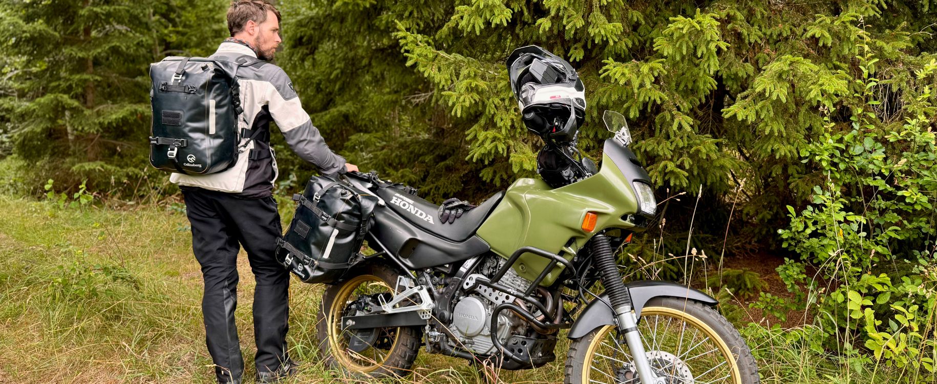 ADV motorcycle rider wearing the and odinsberg ragnarok 30l backpack